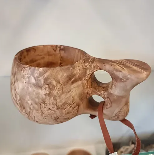 Kuksi with two fingered handle